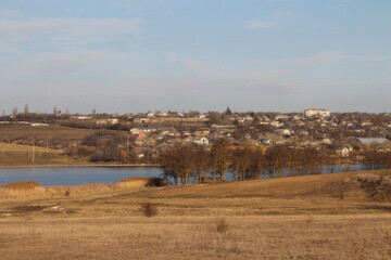 A large field with a city in the background