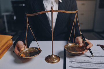 Judge gavel with Justice lawyers having team meeting at law firm background. Concepts of Law and...
