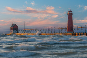Landscape near sunset of the Grand Haven Lighthouse, pier, and catwalk, Lake Michigan, Michigan, USA