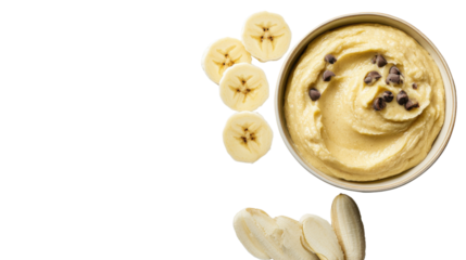 . "An overhead view of banana batter and slices of banana on a clean, olive-hued white background, isolated on transparent background, leaving room for creative text placement