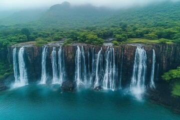 Fototapeta premium Majestic Waterfall Cascading Through Lush Rainforest