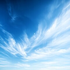 A bright sky blue backdrop with fluffy, soft clouds drifting slowly. The sky has an open, fresh feel, with a light breeze implied by the movement of the clouds.