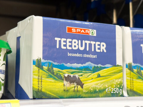 Spar teebutter packaging with pastoral landscape and cow illustration on shelf