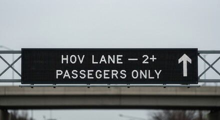 Obraz premium Highway Hov Lane Sign Indicating Carpool and Passenger Requirements Ahead