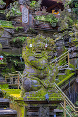 Ubud in the Island of Bali is a very historical and religious cultural city with statues of Hindu Gods and ornate decorated buildings and doors. Balinese revere their gods in Bali Indonesia 