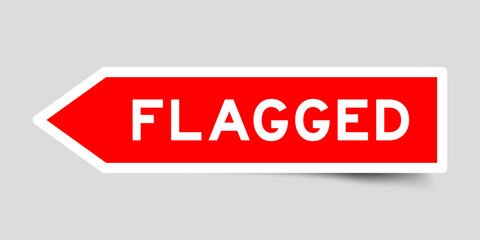 Red color arrow shape sticker label with word flagged on gray background