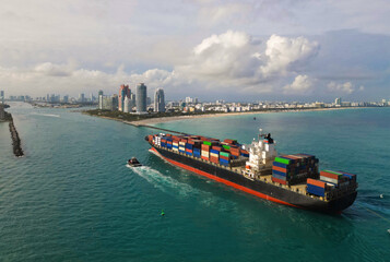 Cargo ship vessel leaving port. Container ship. Export and import. Cargo business. Port of Miami....