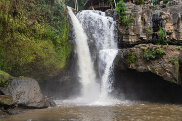 Scenic view of Tegenungan Waterfall in Bali, Indonesia, captured on a bright day