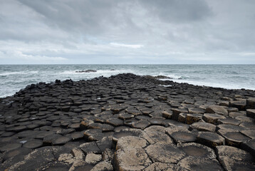 Close-up of hexagonal basalt columns at Giant's Causeway, Ireland. The natural geometric shapes...