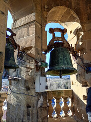 Aged bronze bell in a historic church tower in Sajazarra, Spain