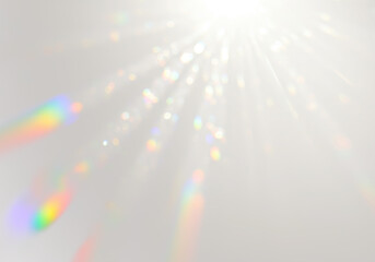 Ethereal light leak effect with bright white source casting diffused beams and spectral rainbow streaks, luminous glow on transparent background