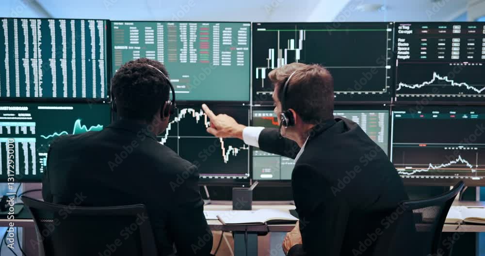 Poster Men, charts and computer screen for stock market, talking and headset with stats, analysis or review. People, partnership and monitor for graphs, trading and revenue with fintech at investment agency