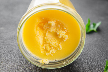 Ghee butter or clarified butter delicious gourmet food background on the table rustic food top view copy space keto and paleo diet vegetarian and vegan food