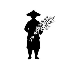 Silhouette of a farmer holding harvested crops with traditional attire in a serene agricultural landscape