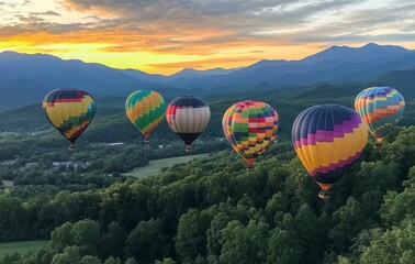 Obraz premium Hot Air Balloons Floating Over Forested Valley with Mountain Views at Sunset