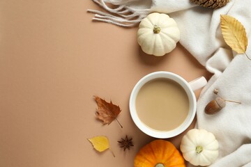 Beautiful autumn composition with pumpkins and cup of coffee on a color background, top view