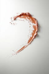 Lipstick smear in artistic heart shape on soft pastel background
