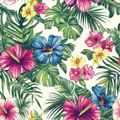 Tropical floral pattern with vibrant hibiscus flowers and lush green leaves