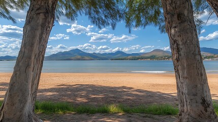 Idyllic beach view framed by trees.