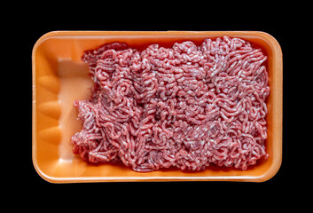 Raw ground meat minced in foam food container. Retail market sale Isolated black background
