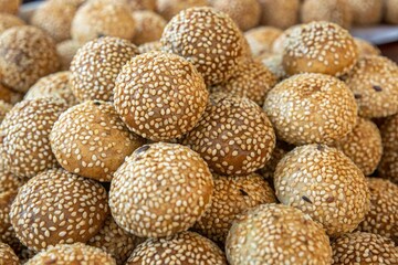 close up of thai donut dessert crispy fry with sweet sesame street food