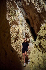 Fototapeta premium Tourists explore the cave. Speleology and geology. Sports and active leisure