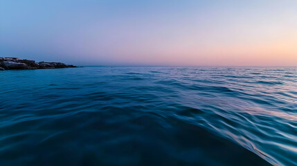 Tranquil Twilight Ocean Scene With Deep Blue Water And Vibrant Sunset Colors Reflecting On The Calm Surface