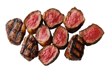 Juicy grilled steak pieces arranged artistically, showcasing perfect sear and tender pink interior. Ideal for food lovers and culinary presentations