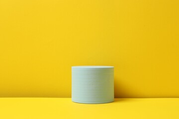 Blue podium on a yellow background