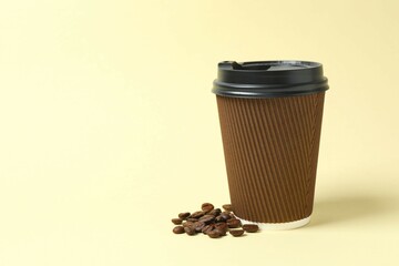 Paper cup with plastic lid on light background. Coffee to go