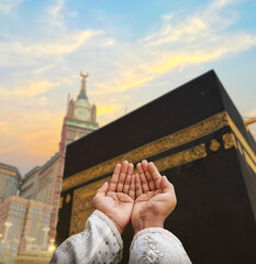 Hand of Muslim man praying with mosque background. Islamic wallpaper concept of eid, Ramadan,...