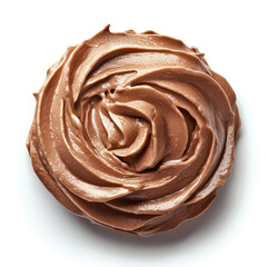 A top view of a rosette of chocolate frosting on a white surface in a studio shot