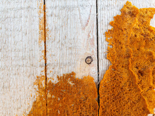 Weathered white wood with rustic orange stains texture as background