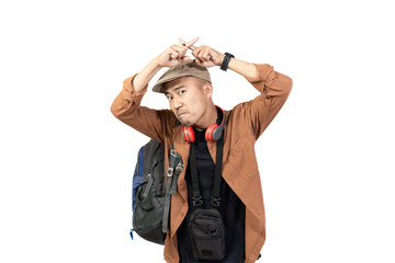 Young Indonesian male traveler looking disappointed and angry while traveling, travel concept, isolated on white background.