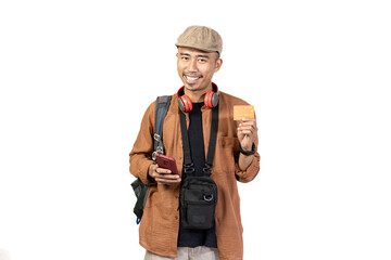 Young Indonesian male traveler traveling with credit card, convenience of cashless transaction, travel concept, isolated on white background.