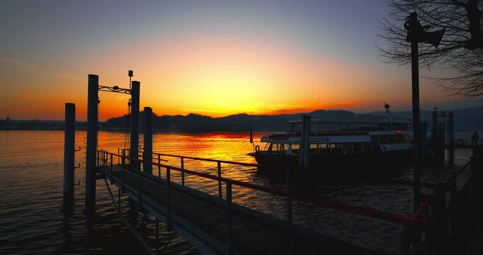 Red sunset on the pier of Angera on Lake Maggiore