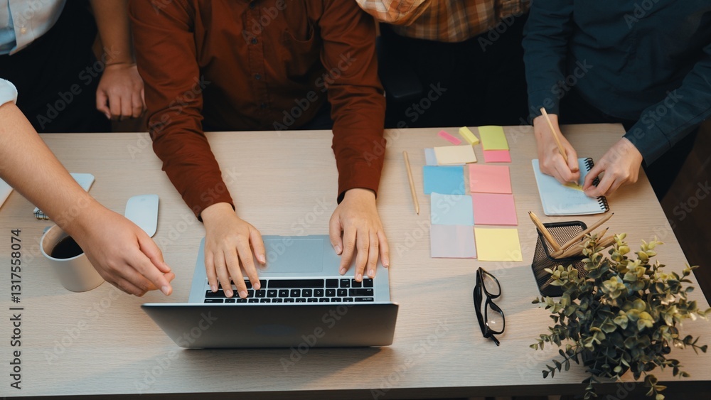 Poster a dynamic workspace showcasing diverse hands collaborating around a laptop, surrounded by colorful s