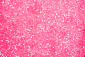 A soft pink bokeh-style background with unfocused light creates an elegant space for text or design elements.