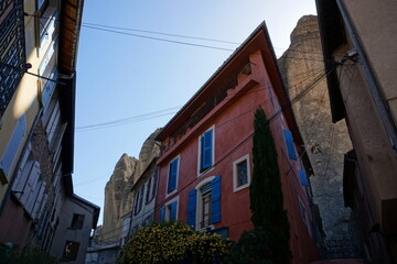 view of the village de Les Mées in the south of France by the unusual rocky outcrop
