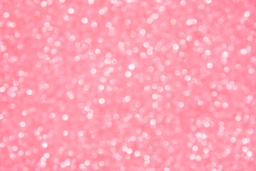 A soft pink bokeh-style background with unfocused light creates an elegant space for text or design elements.