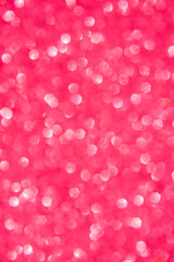 A soft pink bokeh-style background with unfocused light creates an elegant space for text or design elements.