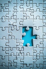 Fototapeta premium Incomplete jigsaw puzzle, missing piece, light blue background