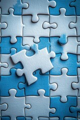 Blue and white puzzle piece nearly complete