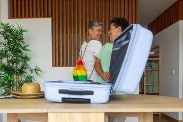 Lesbian couple packing for a summer holiday trip