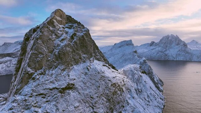 flight over snowy Segla summit at Mefjord on Senja Island
