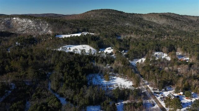 Fly across the New Hampshire forest scene during winter season