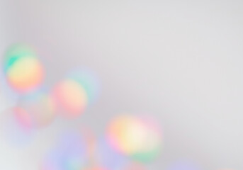 Soft bokeh effect with blurry round rainbow coloured lights on transparent background