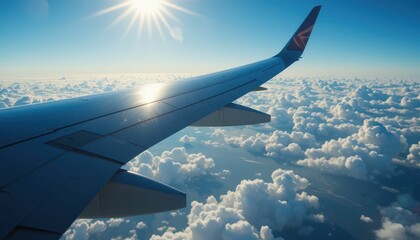 Obraz premium Stunning View from Airplane Wing Over Fluffy White Clouds