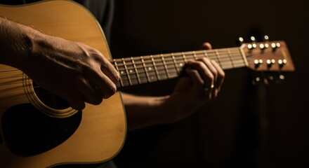 Fototapeta premium Close-up of Guitarist's Hands Playing Acoustic Guitar