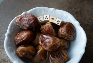 dried fresh dates on a plate macro shot